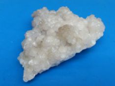 A geological sample of white/ grey partially translucent crystals,