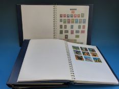 A collection of foreign stamps in four albums