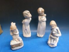 Four various Nao figures of children including one of a girl with a doll and another holding a