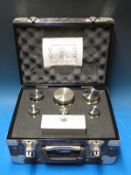 A cased set of Reverifications Ltd standard weights comprising stainless steel weights from 7lb