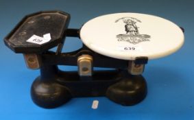A set of cast iron shop scales with ceramic pan