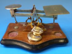 A set of brass postage scales with rates to pan,