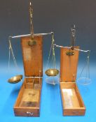A cased set of travelling beam scales, the case lid,
