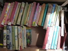 A tray of Enid Blyton children's books together with a quantity of Ladybird books,