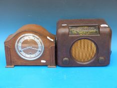 A Bush bakelite radio and a three train mantel clock