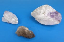 Three geological samples, two formed of snow coloured stone,