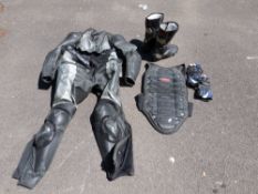 A motorcycle rider's leathers to include boots, jacket, trousers,
