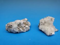 Two small geological sample formed of small grey/white crystals, one with clusters of gold,