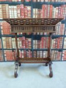 A pierced mahogany plant stand with scrolling design to legs