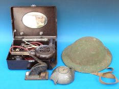 A WWI military helmet, vintage hairdryer,