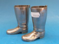 A pair of boot shaped novelty measures 1oz and 1½oz