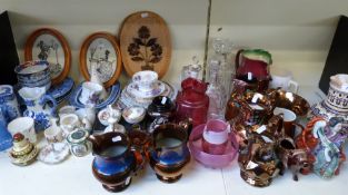A large quantity of ceramics and glass including Cranberry glass jug, Goss crested ware,