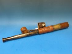 A WWI leather and brass telescope marked T.T & H Ltd 1918 no. 35650 Tel. sig. (Mk IV) also G.S.