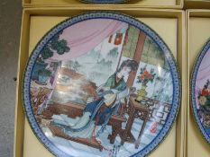 Four boxed artisan painted plates by 'Master Artisan Zhao Huimin'