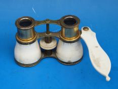 A pair of gilt and ivory opera glasses inscribed Woodward, Clements Inn Passage,
