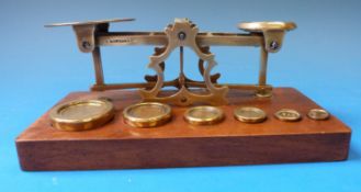 A set of S Mordan & Co postage scales with 1p to 8p weights and  ¼ oz and 2 dram weights to base