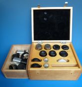 A cased J Swift London microscope with various lenses and a further selection of lenses