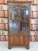 A glazed concave corner cupboard (H188 x W91cm)