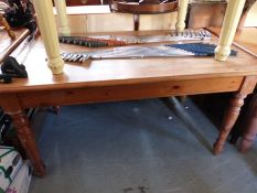 A pine kitchen table with single drawer to both ends (L150 x W87 x H76cm)