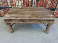 A rustic hardwood coffee table