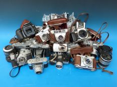 A box of vintage cameras to include Kodak Retinette, Minolta, Pentax, Canon,