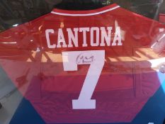 A signed Eric Catona Manchester United football shirt,