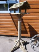 A wooden bird table