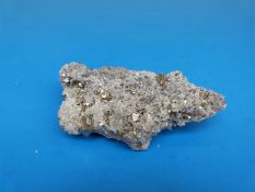 A geological sample formed of very small grey crystals,