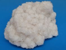 A snow coloured geological sample formed of clusters of individual crystals,