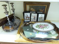 A pair of plated candlesticks, Mappin & Webb toast rack, galleried tray, military prints,