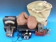 A quantity of vintage cameras and accessories to include Polaroid together with an AVO meter,