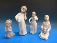 Four Nao figures including an angel playing a banjo,