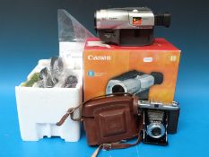 A Zeiss Ikon camera and a boxed and unused Canon UC8000 video camera