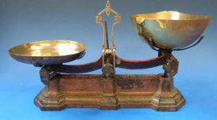 A set of 19thC W & T Avery 4lb counter top scales with cast iron base and brass pans