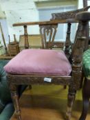 A 19thC carved oak corner chair