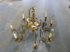 Brass chandelier, pair of ceramic wall lights,