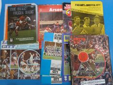 A collection of football programmes and black and white photographs to include Chelsea,