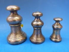 Three Scottish bell weights comprising 4lb,