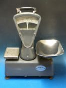 A set of Reverifications Ltd 2kg travelling verification scales,