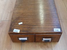 A two drawer oak index card cabinet,
