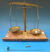 A brass W&T Avery 250g beam scale on wooden base