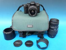 A Sigma SA-7 camera 28-80mm HF lens together with a Sigma 70-300mm DL macro super lens,