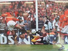 A signed print of Eric Cantona scoring the winning goal in the 1996 FA Cup final for Manchester
