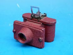 A miniature cast metal spy camera