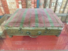 An upholstered carved oak campaign footwarmer with original tin water container within (29 x 26cm)