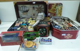 A quantity of collectables including matchboxes, tins, toy cars,