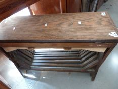 An oak folding camping bed