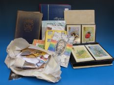 A Triumph stamp album, all reigns, two stockbooks, PHQ cards,