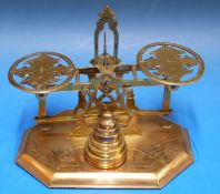A set of probably Mordan postage scales having pierced and engraved pans and A frame,