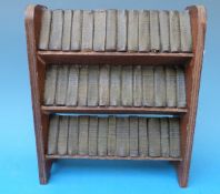 Miniature oak bookcase containing the complete works of Shakespeare